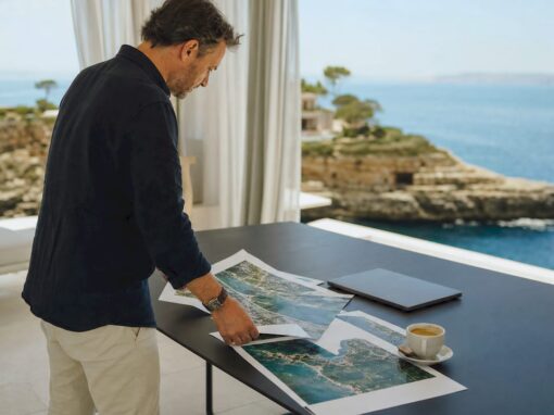 Real estate agent reviewing Mallorca coastal property documents