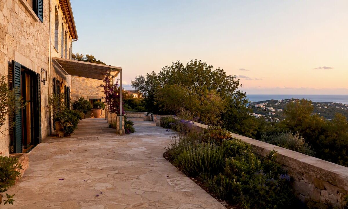 Sunlit villa facade and garden in Mallorca in September